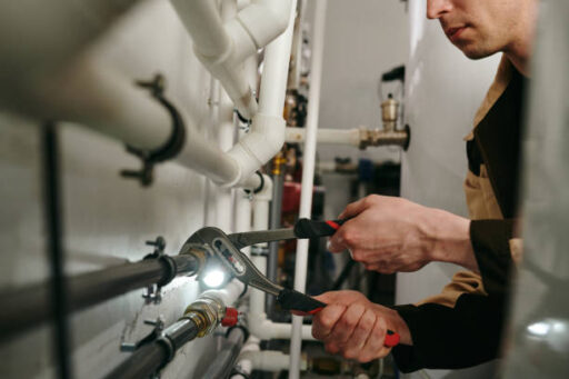 A man doing some plumbing work.