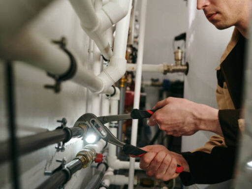 A man doing some plumbing work.