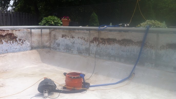 An empty pool with tools to detect leaks in it